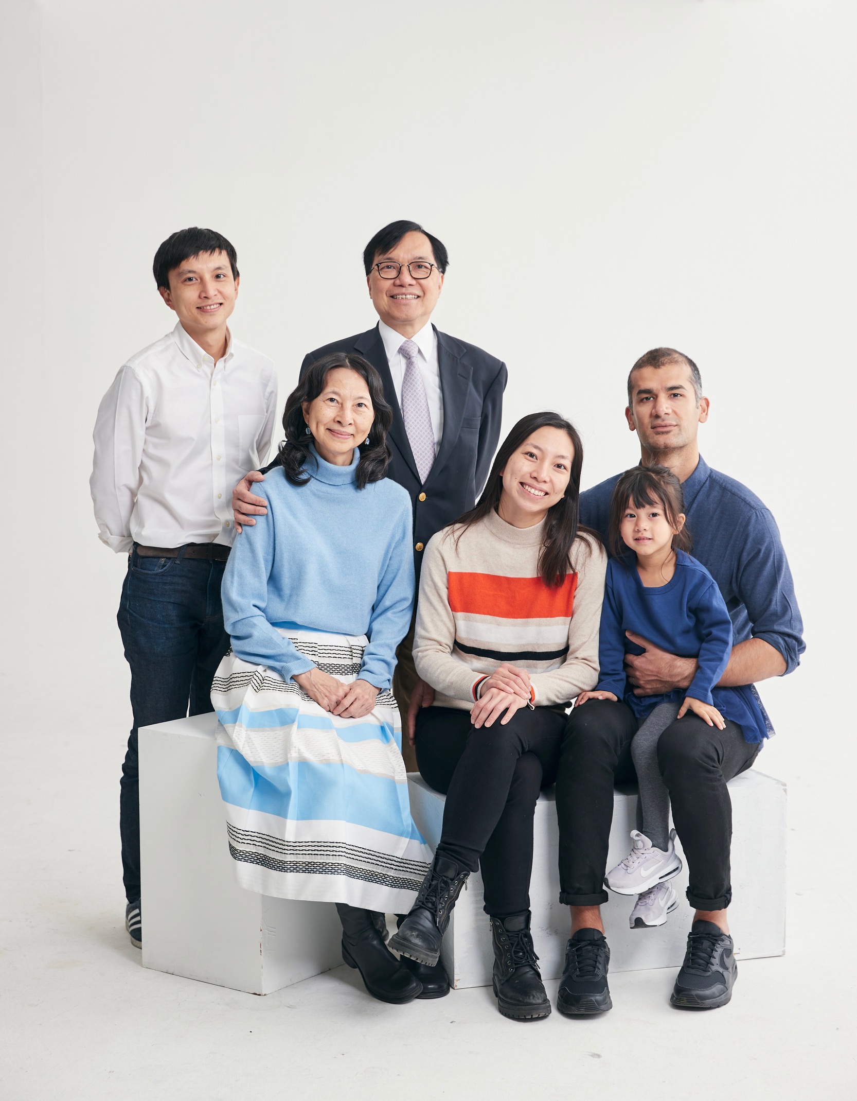 A group of people posing for a photo
Description automatically generated